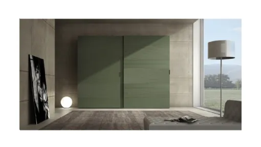 Armadio laccato opaco verde prussia con inserti in cemento Comp 06 di Voltan